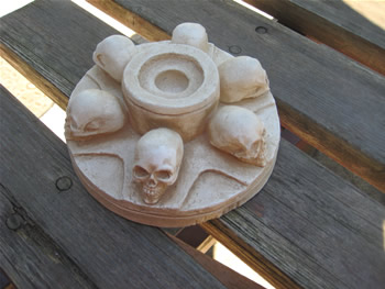 Skull candleholder lights up the garden patio